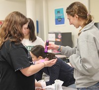 binghamton university representative showing another student demonstration