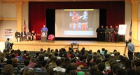 wide shot of lucas scott speaking at no empty chair campaign kick off presentation