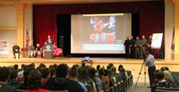 wide shot of presenter speaking at no empty chair campaign kick off presentation