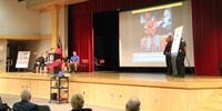 wide shot of principal ostrander speaking at law enforcement official speaking at no empty chair cam