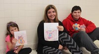 students with books, drawings and sewn monsters 8