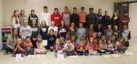 high school, middle school and kindergarten students in hallway with monster creations 2