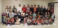 high school, middle school and kindergarten students in hallway with monster creations 1