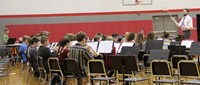 high school band students performing