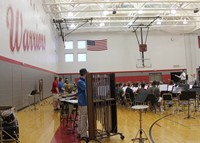 medium shot of high school band students performing