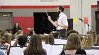 middle school band students performing