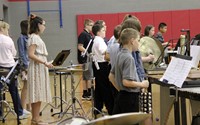 middle school band students performing