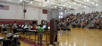 wide shot of middle school band students performing