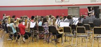 middle school band students performing