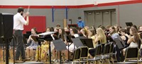 high school band students performing