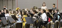 middle school band students performing