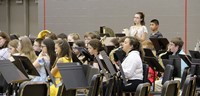 middle school band students performing