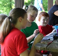 students at face painting activity