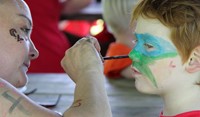 student getting face painted