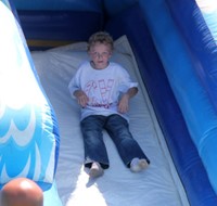 studen going down inflatable slide