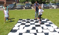 students playing giant checkers game