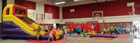 wide shot of indoor gym activities