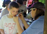 student having face painted