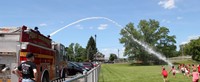 port dickinson fire truck spraying field of students 2