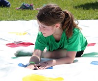 student taking part in twister activity
