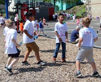 four students dancing