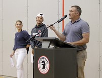 indoor track and field team members and coach