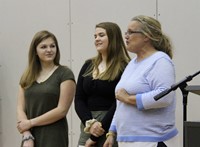 girls tennis team members and coach