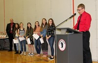 girls cross country team members and coach