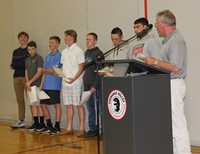 boys golf team members and coach