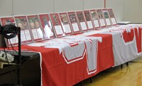 wide shot of athletes award plaques