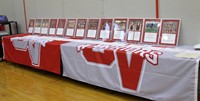 wide shot of athletes award plaques