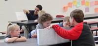 high school students reading to kindergarten students 18