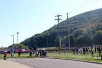 wide shot of people at cross country race