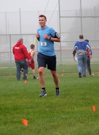 person running at cross country race