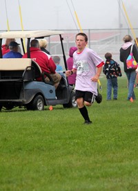 person running at cross country race