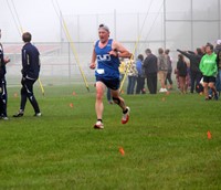 person running at cross country race