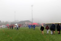 wide shot of people at cross country race