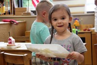 student throwing away lunch