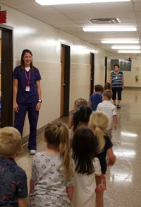 students meeting school nurse