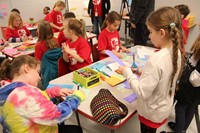 students working at kindness station