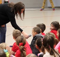 another student answering question at morning assembly