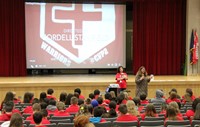 school counselor speaking at middle school presentation