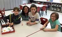 students and teacher smiling