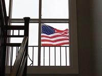 american flag through window