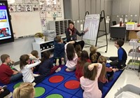 teacher teaching students in classroom