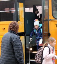 principal greeting students