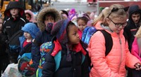 students walking towards school