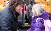 principal greeting student