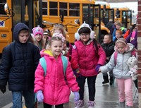 students walking towards school