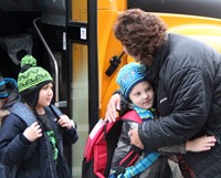 student hugging principal